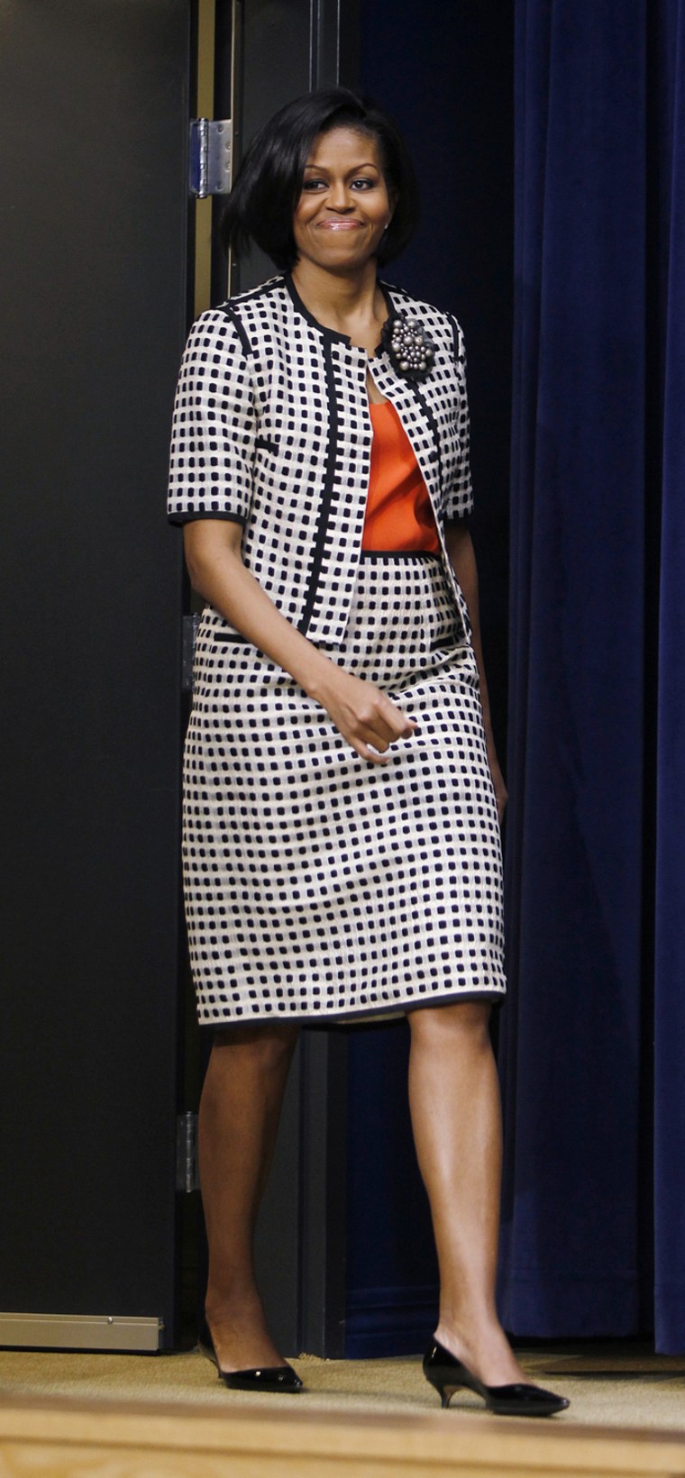 Image: U.S. first lady Michelle Obama arrives to speak at the White House Council on Women and Girls' Forum on Workplace Flexibility in Washington
